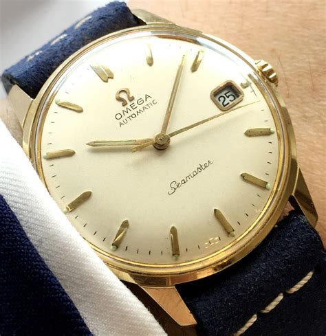 omega vintage 18k gold watch.